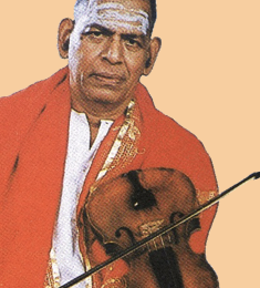 M. S. Gopalakrishnan seated with violin