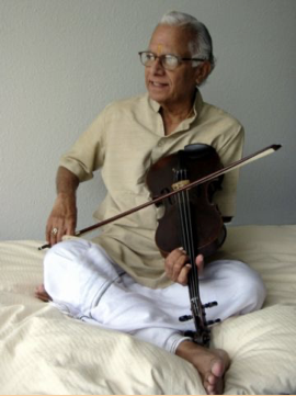 T. N. Krishnan seated with violin